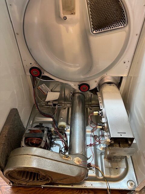 Inside of a gas dryer during repair in Waldorf